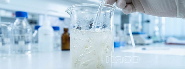 Emulsion in laboratory glassware, symbolizing the mixing of oil and water